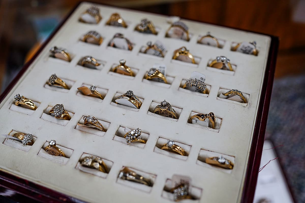 Tray of gold and diamond rings in the jewelry case