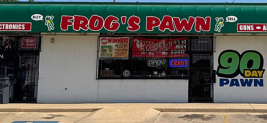 The Frog's Pawn storefront on SW Lee Blvd, with red lettering on a green awning
